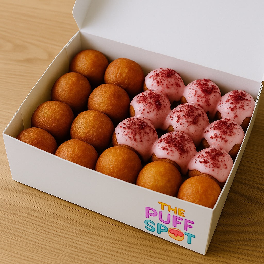 Branded box with plain and pink iced puff puffs